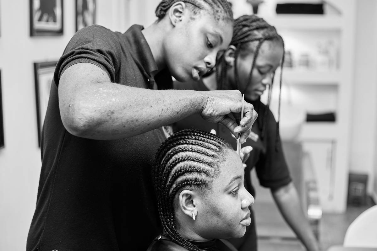 Photo of a customer making her hair in the saloon.