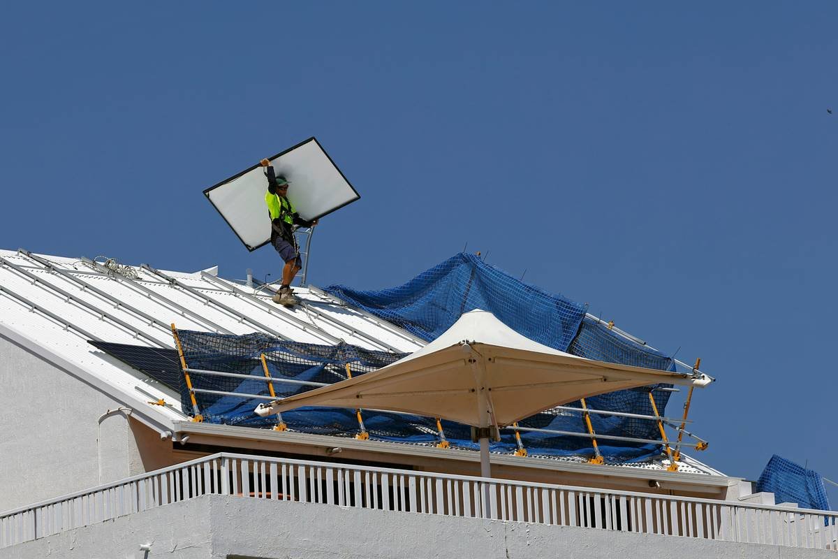 how to install bifacial solar panels with elevated mounting structure on reflective surface